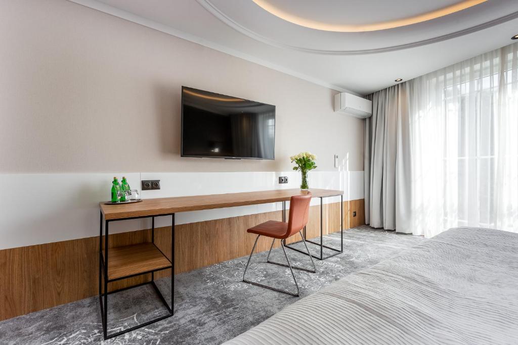 Televízia a/alebo spoločenská miestnosť v ubytovaní City Apartments - Młyńska 49