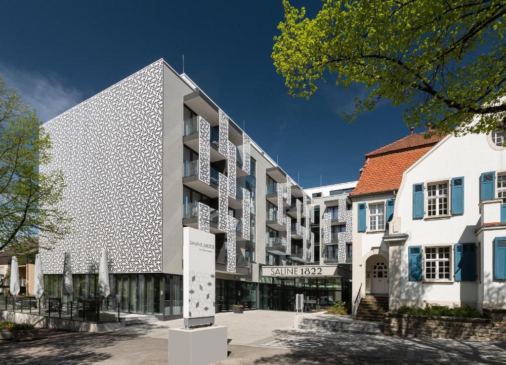 an apartment building with a facade of white at Saline1822 in Bad Rappenau