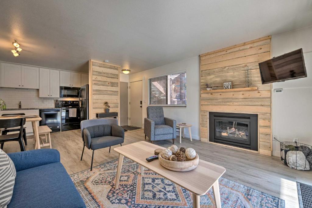 a living room with a couch and a fireplace at Park City Condo at Canyons Village with Amenities! in Park City