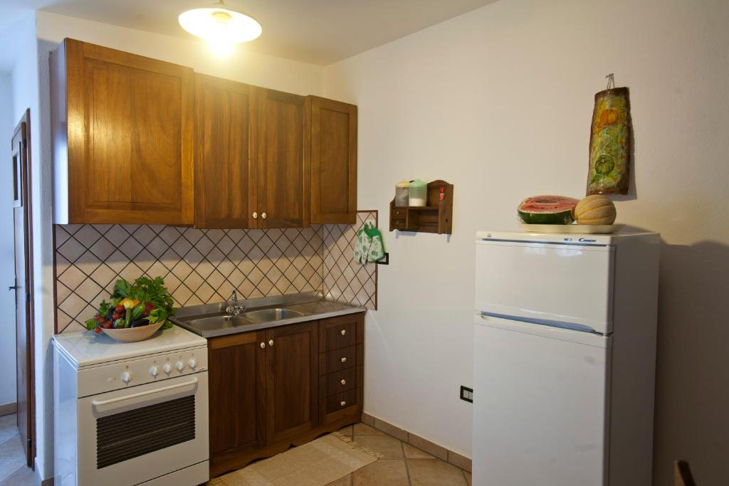Kuchyň nebo kuchyňský kout v ubytování Residencefusaro pajare Specchia