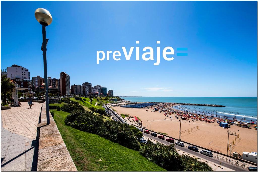 a view of a beach with a street light at DeptosVip - Rivas in Mar del Plata