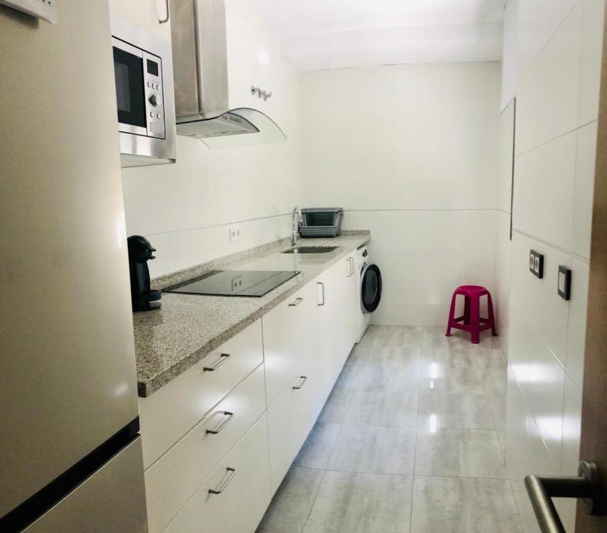 Kuchyň nebo kuchyňský kout v ubytování Low cost rooms La Merced