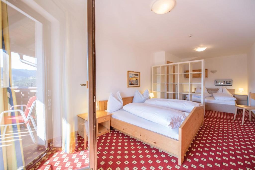 Posteľ alebo postele v izbe v ubytovaní Apparthotel Feldhof - Living and Bistro