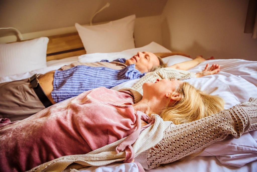 Postel nebo postele na pokoji v ubytování ILEX Appartements