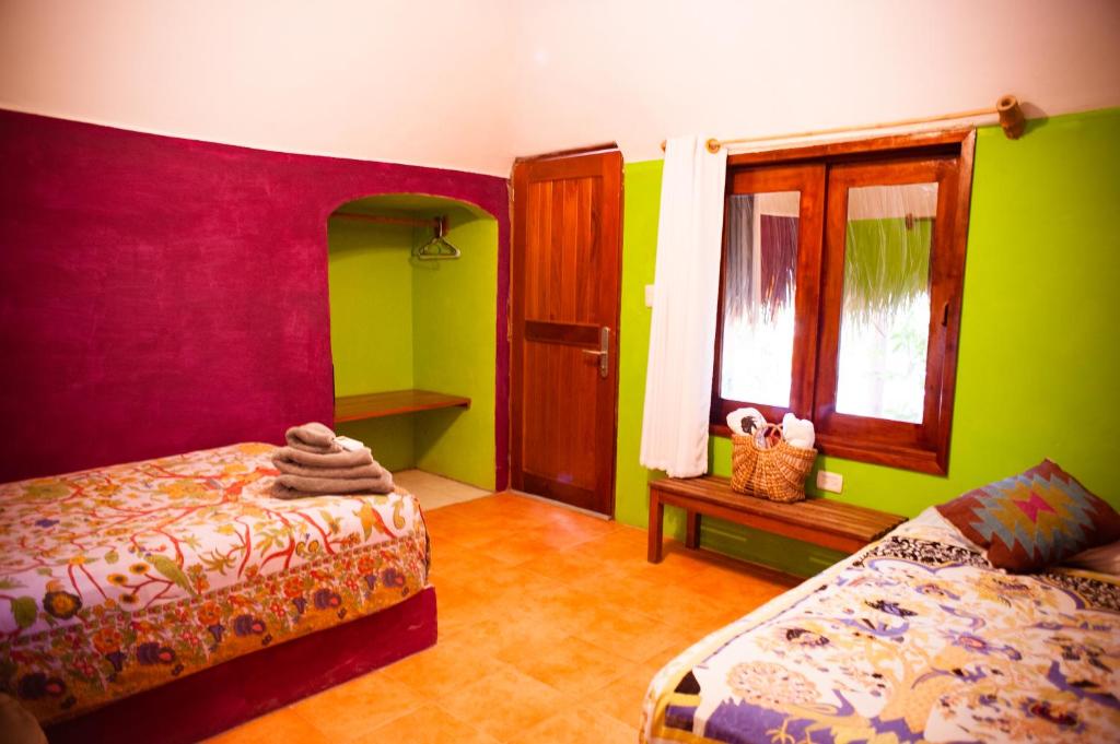 Postel nebo postele na pokoji v ubytování Nacional Beach Club & Bungalows