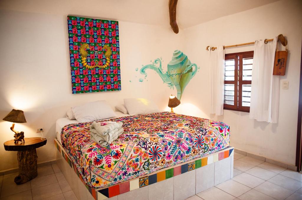 Postel nebo postele na pokoji v ubytování Nacional Beach Club & Bungalows
