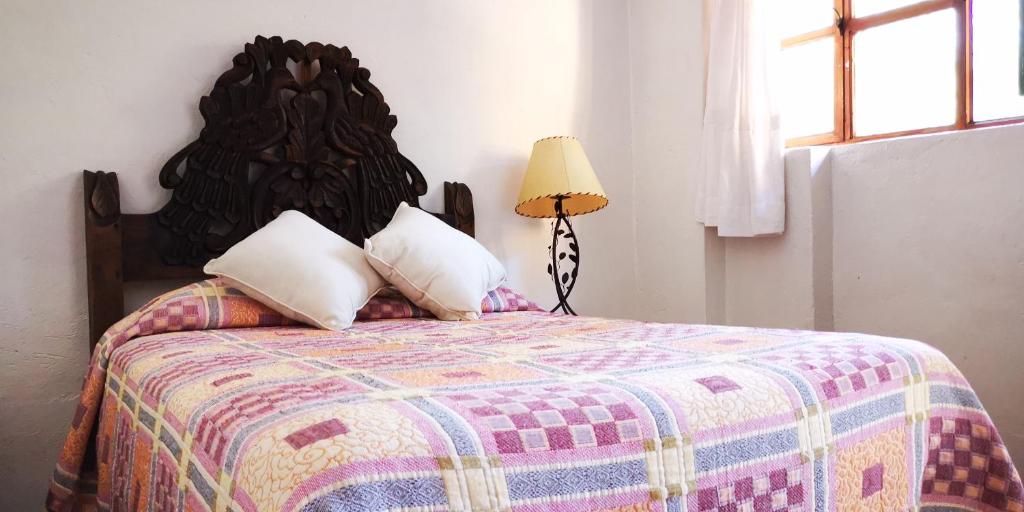 Postel nebo postele na pokoji v ubytování Hotel Sautto
