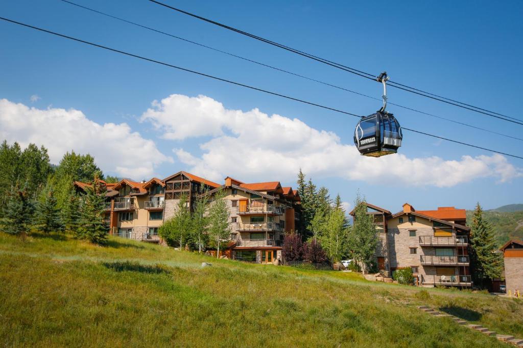 a gondola lift in front of a resort at The Crestwood Snowmass Village in Snowmass Village