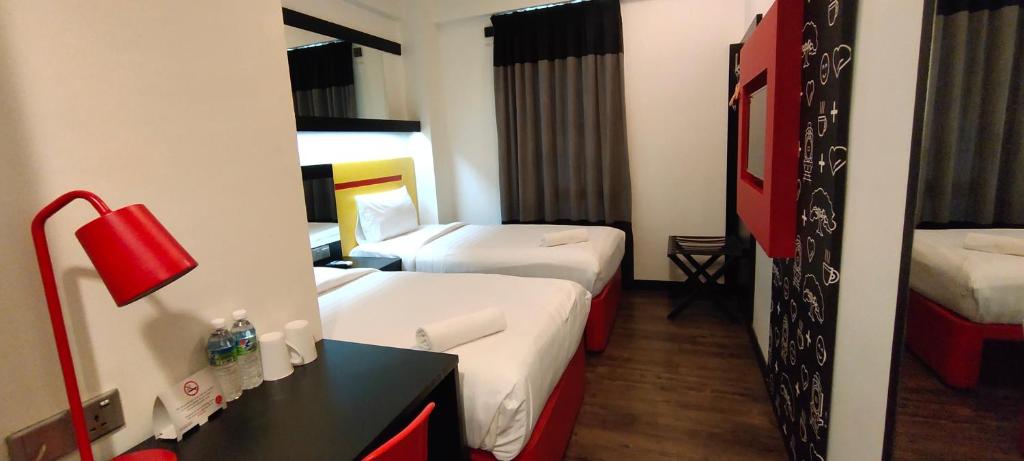 Postel nebo postele na pokoji v ubytování Sense Hotel Taiping