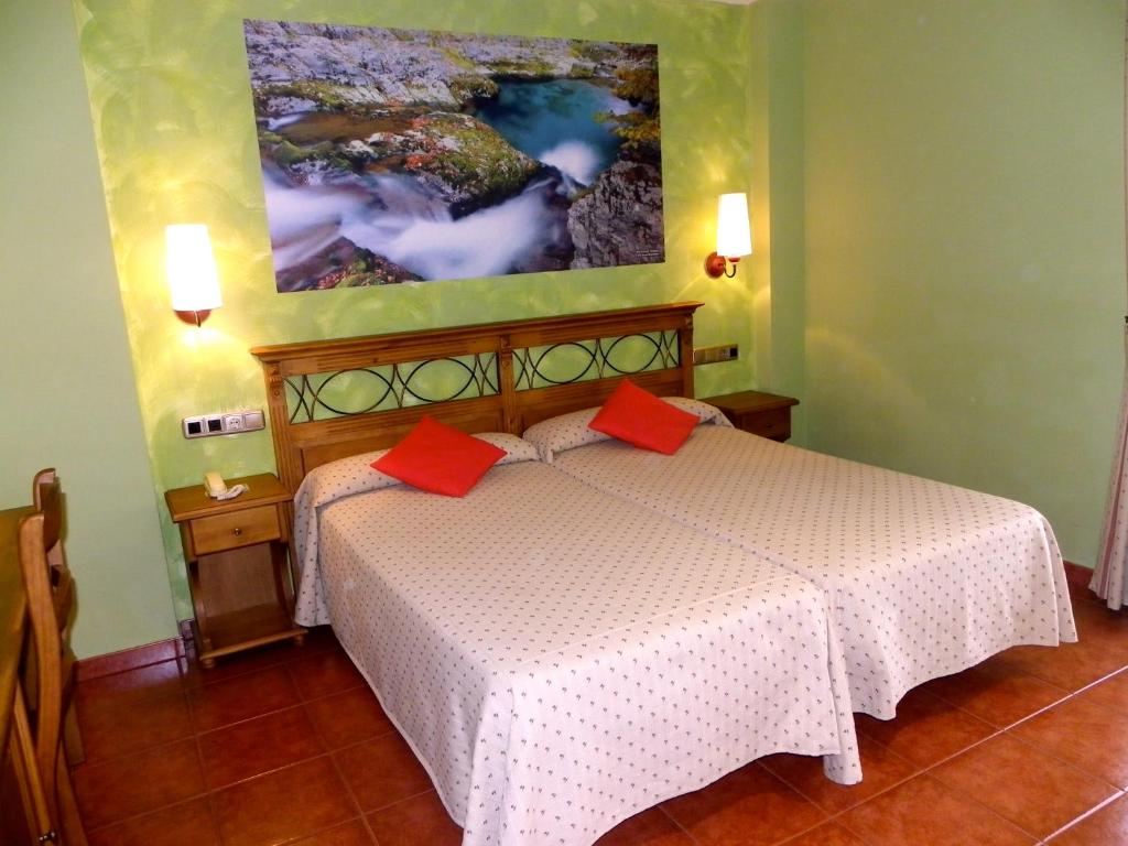 Cama o camas de una habitación en Hotel Arnal