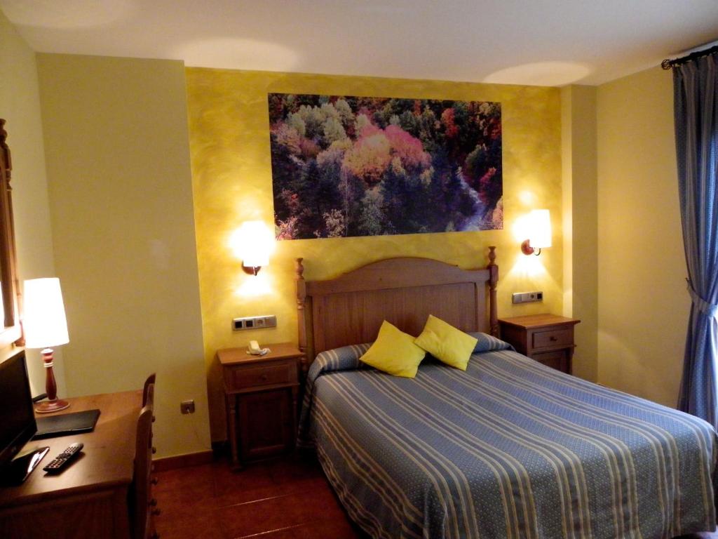 Cama o camas de una habitación en Hotel Arnal