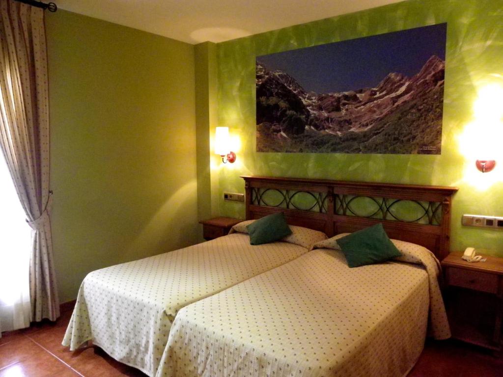 Cama o camas de una habitación en Hotel Arnal