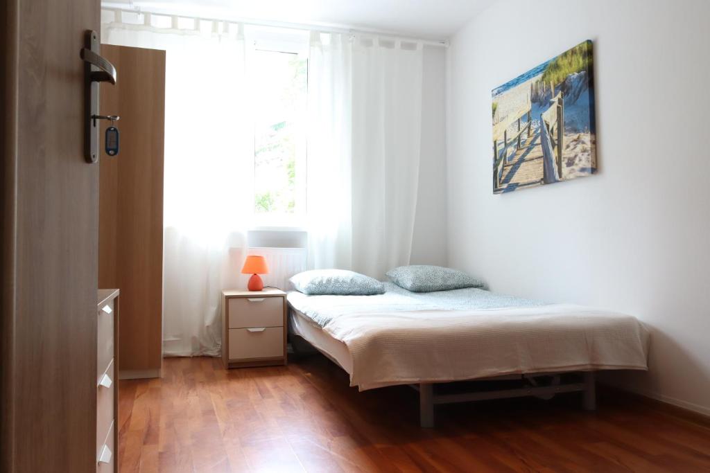 Giường trong phòng chung tại City Apartments & Gym
