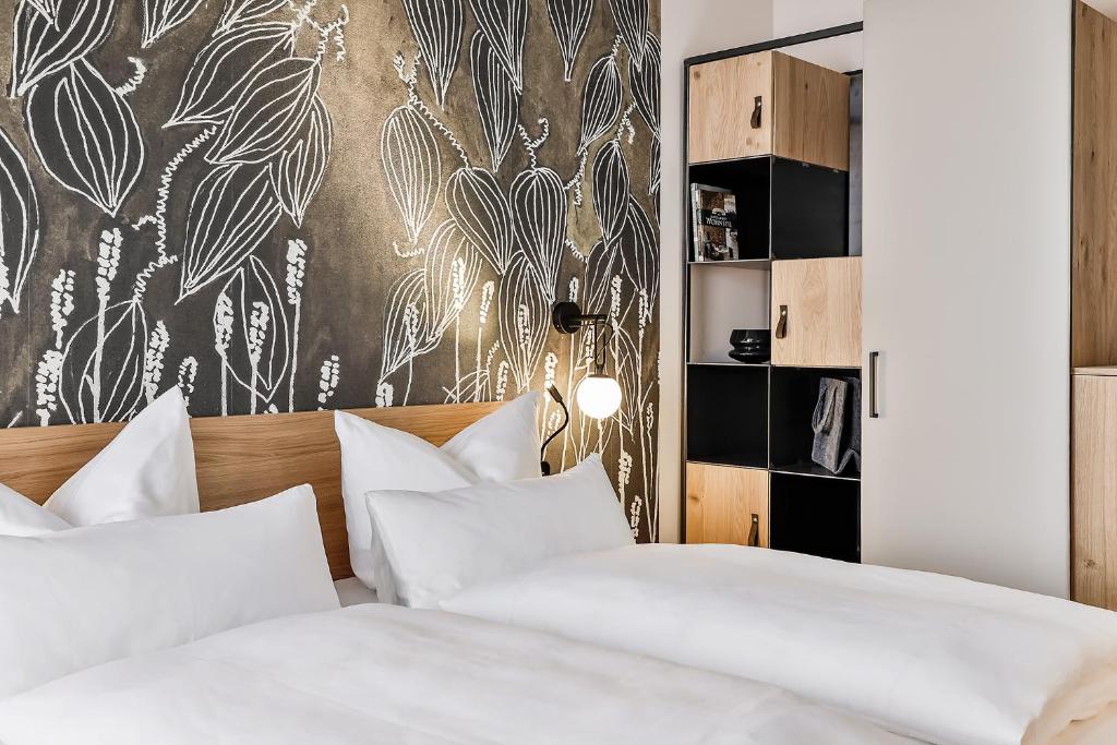Postel nebo postele na pokoji v ubytování WeinHotel Fritz Walter