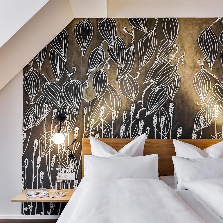 Postel nebo postele na pokoji v ubytování WeinHotel Fritz Walter