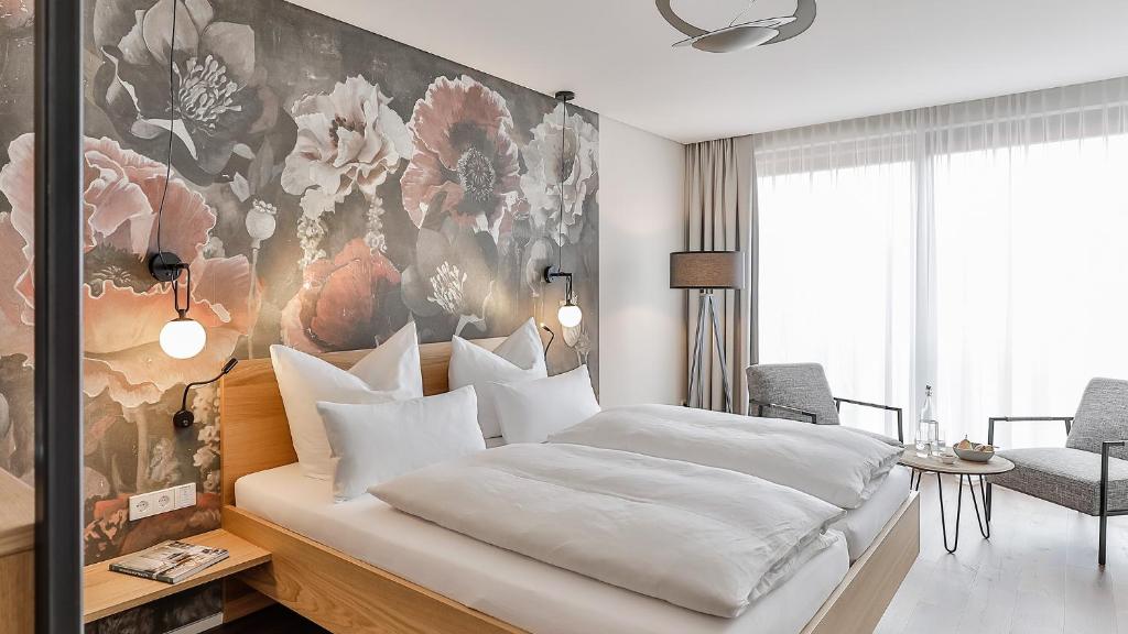Postel nebo postele na pokoji v ubytování WeinHotel Fritz Walter