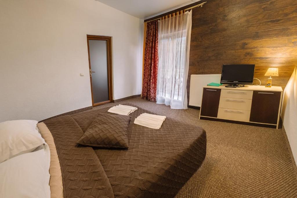 Postel nebo postele na pokoji v ubytování SPA Hotel Zhyva Voda