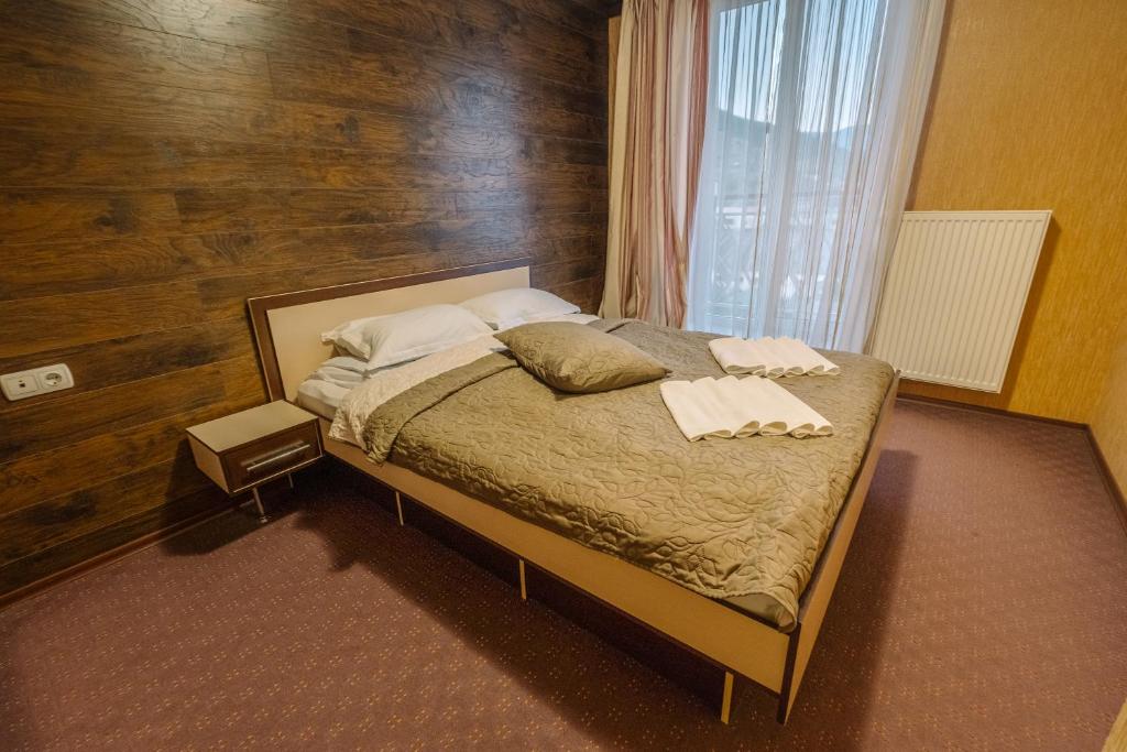 Postel nebo postele na pokoji v ubytování SPA Hotel Zhyva Voda