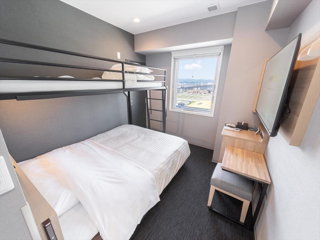 Postel nebo postele na pokoji v ubytování Super Hotel Tokyo Akabane Eki Minamiguchi
