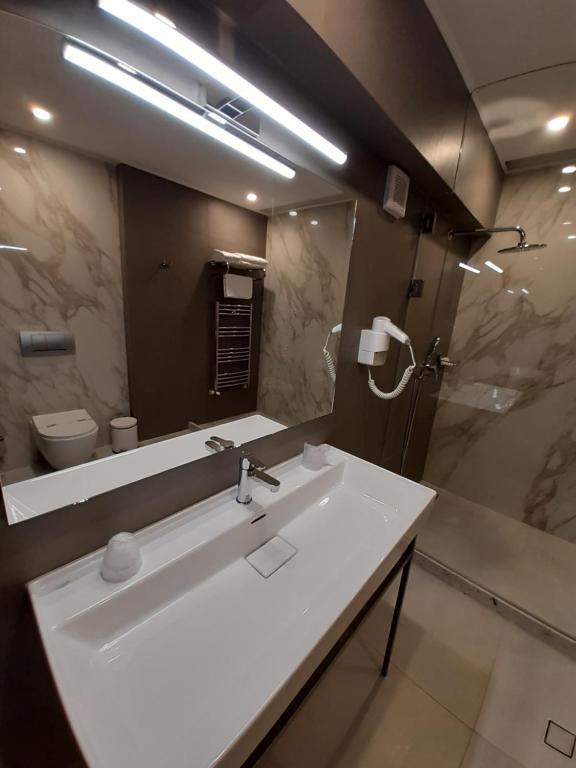 Koupelna v ubytování Hotel Univers