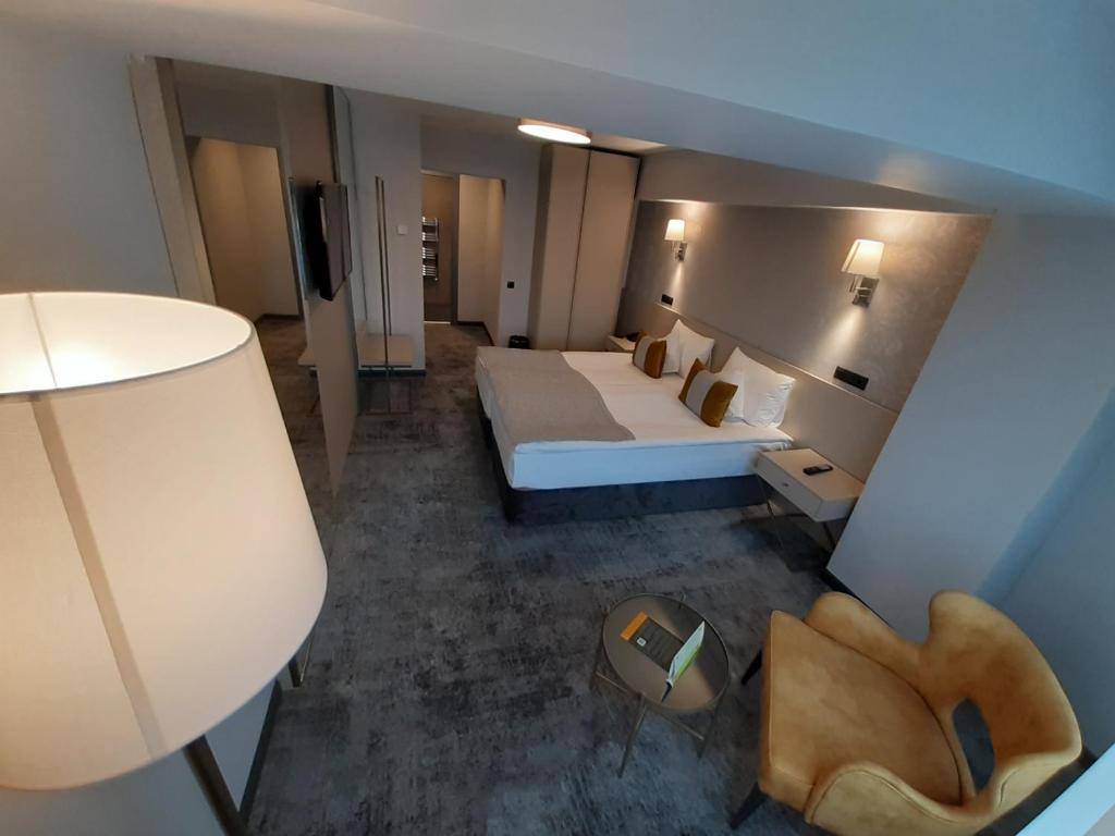 Postel nebo postele na pokoji v ubytování Hotel Univers