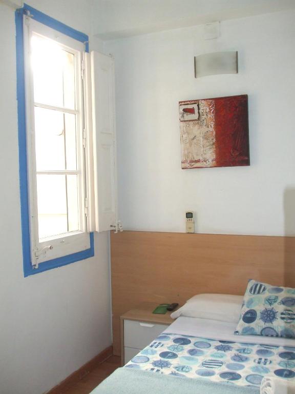 Postel nebo postele na pokoji v ubytování Hostal Felipe 2