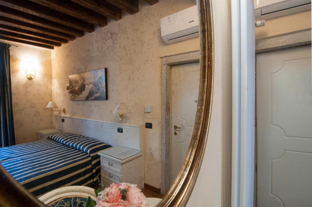 Postel nebo postele na pokoji v ubytování Venice Resorts Guest House