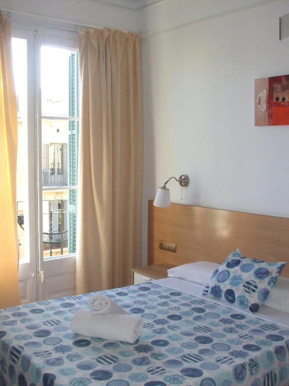 Postel nebo postele na pokoji v ubytování Hostal Felipe 2