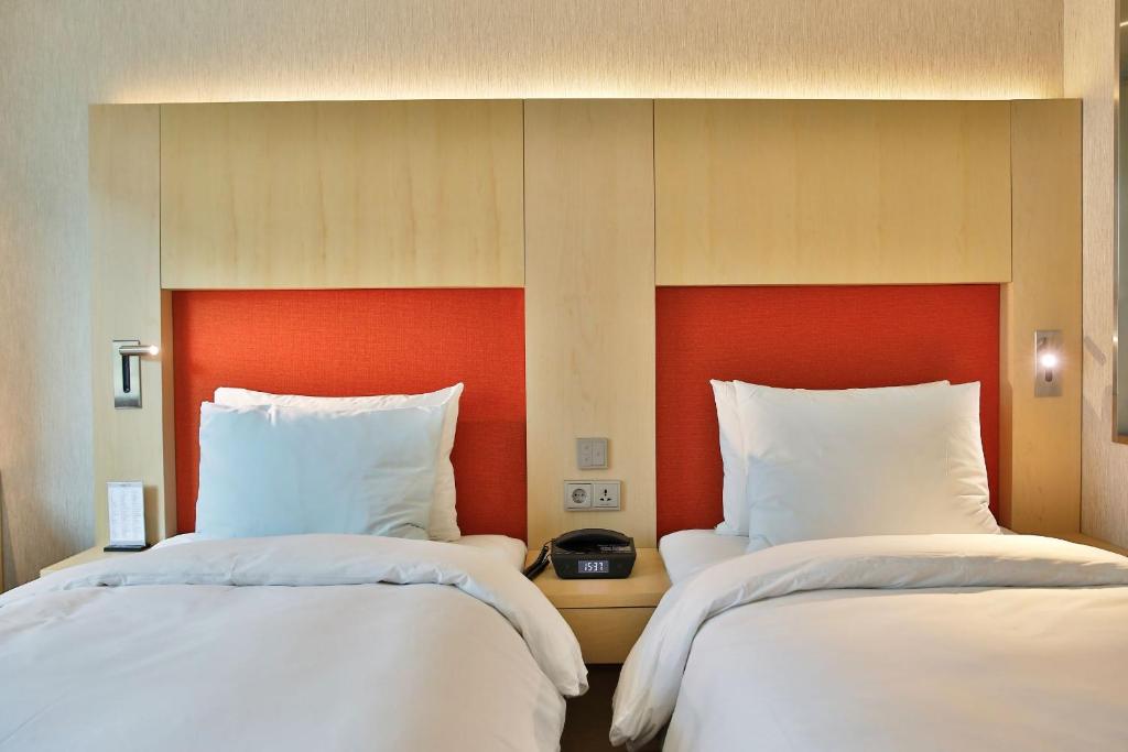 Krevet ili kreveti u jedinici u okviru objekta Hotel Midcity Myeongdong