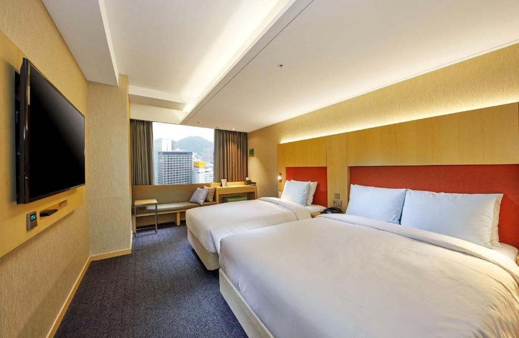 Krevet ili kreveti u jedinici u okviru objekta Hotel Midcity Myeongdong