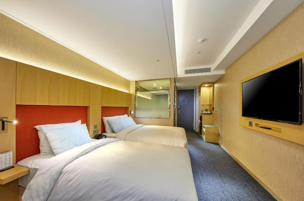 TV i/ili multimedijalni sistem u objektu Hotel Midcity Myeongdong