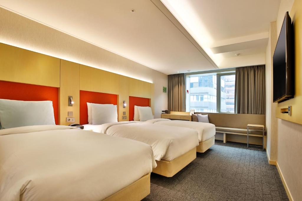 Krevet ili kreveti u jedinici u okviru objekta Hotel Midcity Myeongdong