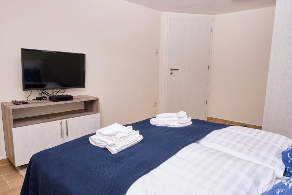 Postel nebo postele na pokoji v ubytování Kincses Sziget Apartman