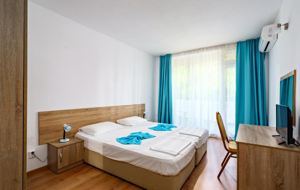Postel nebo postele na pokoji v ubytování Hotel Elitza