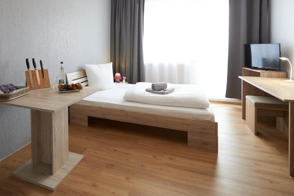Letto o letti in una camera di Hotel Weimarer Berg
