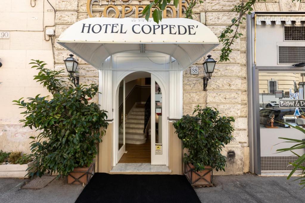 a hotel corporate sign over the door of a building at Hotel Coppede' in Rome