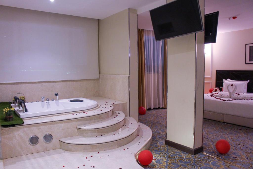 Postel nebo postele na pokoji v ubytování Rollins Hotel