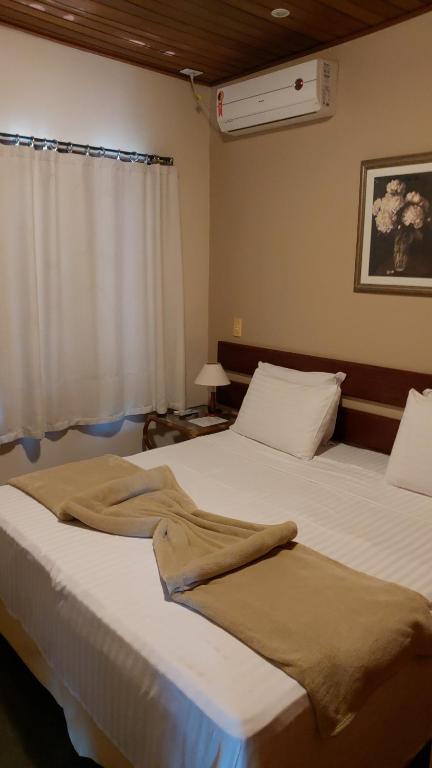 Postel nebo postele na pokoji v ubytování Taipabas Hotel