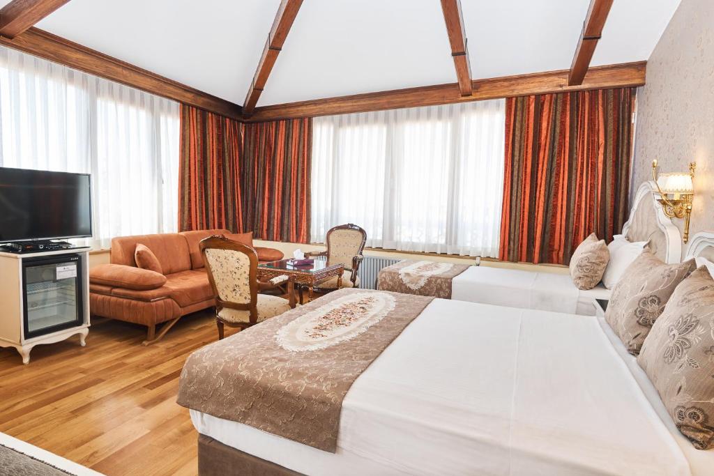 A bed or beds in a room at Best Western Empire Palace Hotel & Spa
