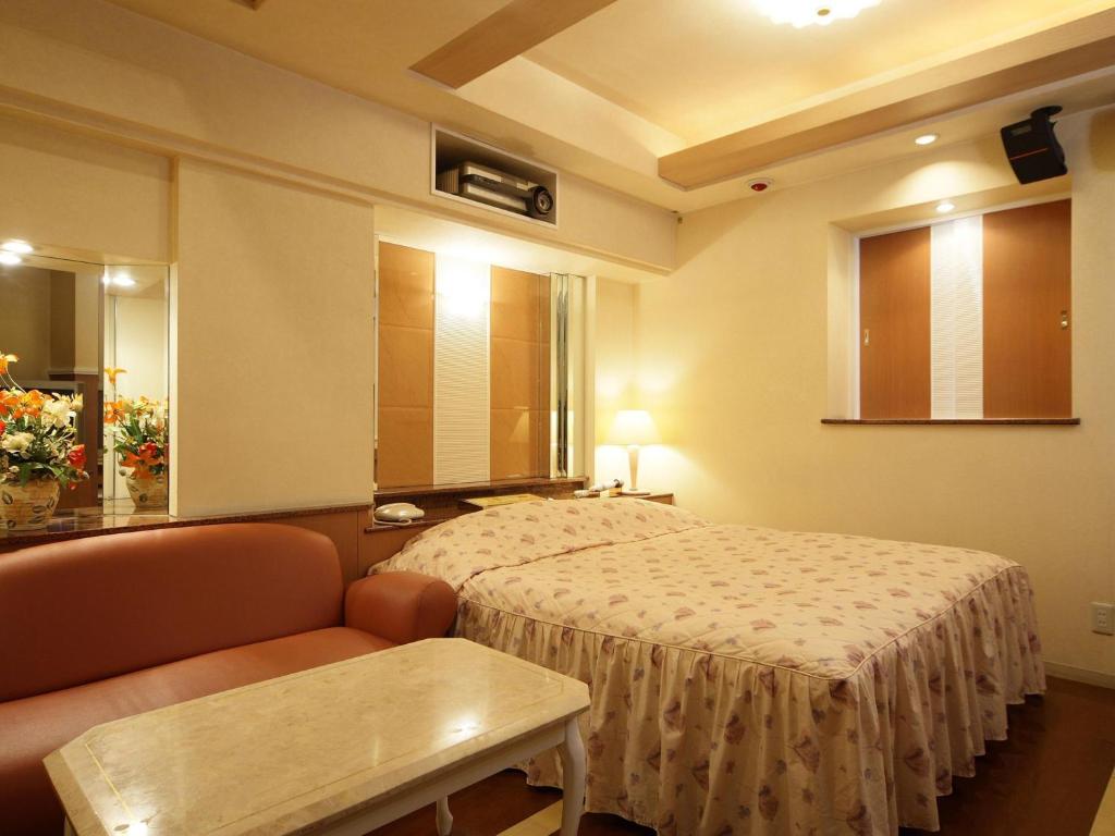 Postel nebo postele na pokoji v ubytování Hotel Fine Sakai