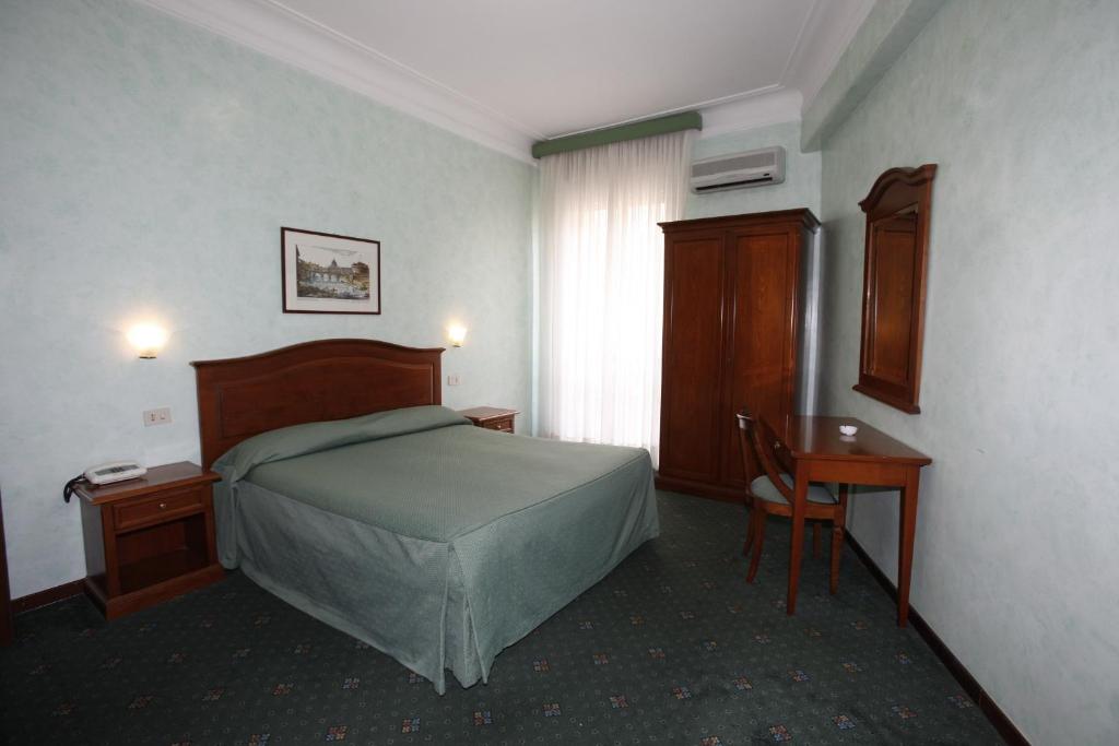 Postel nebo postele na pokoji v ubytování Hotel Adriatic