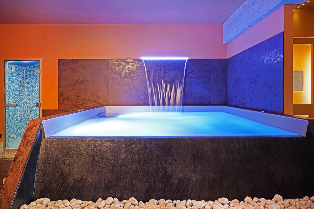 Postel nebo postele na pokoji v ubytování Hotel Daniel