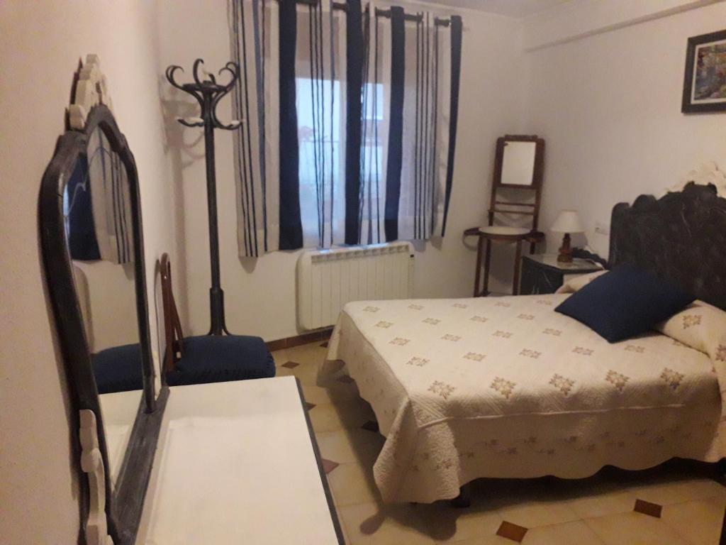 Postel nebo postele na pokoji v ubytování Casa Rosalia