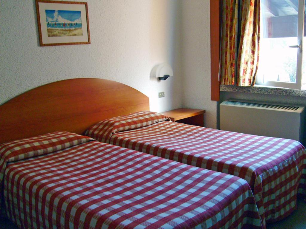 Postel nebo postele na pokoji v ubytování Golf Hotel