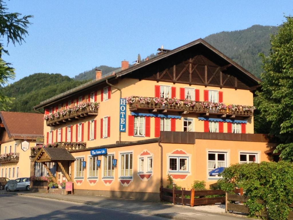 a building with balconies on the side of it at Hotel Waltraud Garni in Kochel