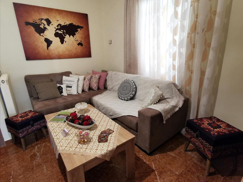 a living room with a couch and a table at Delphic Horizons in Delphi