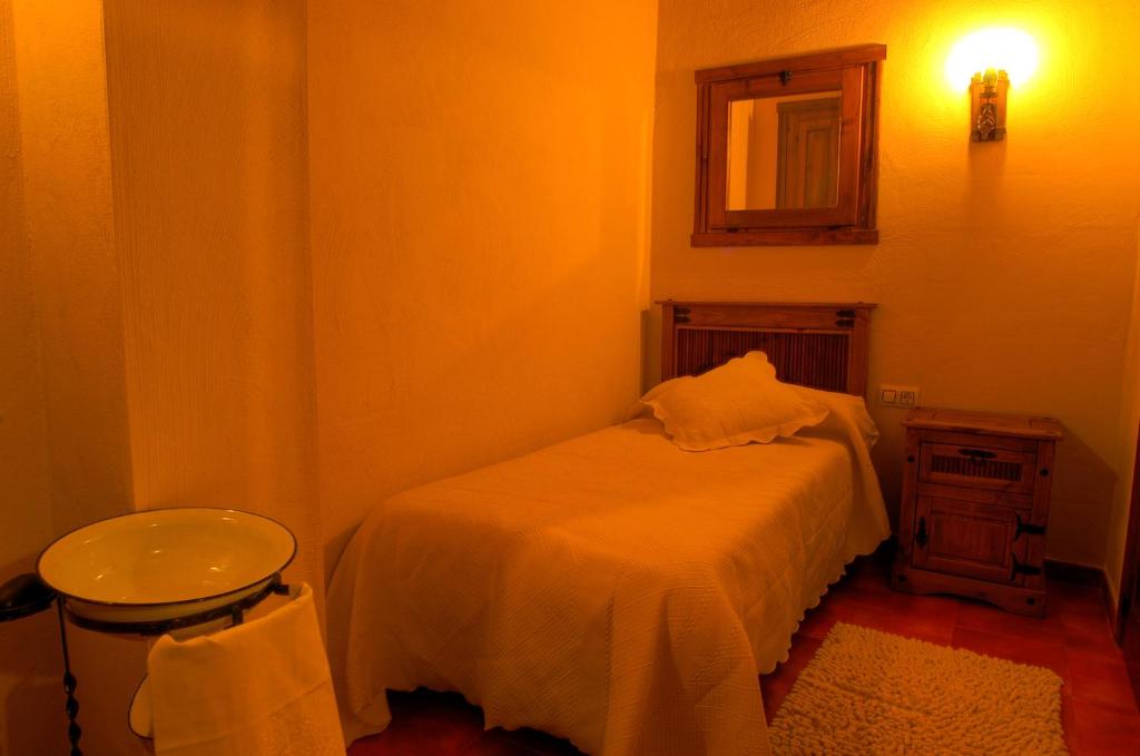 Cama o camas de una habitación en Complejo Rural Las Palomas
