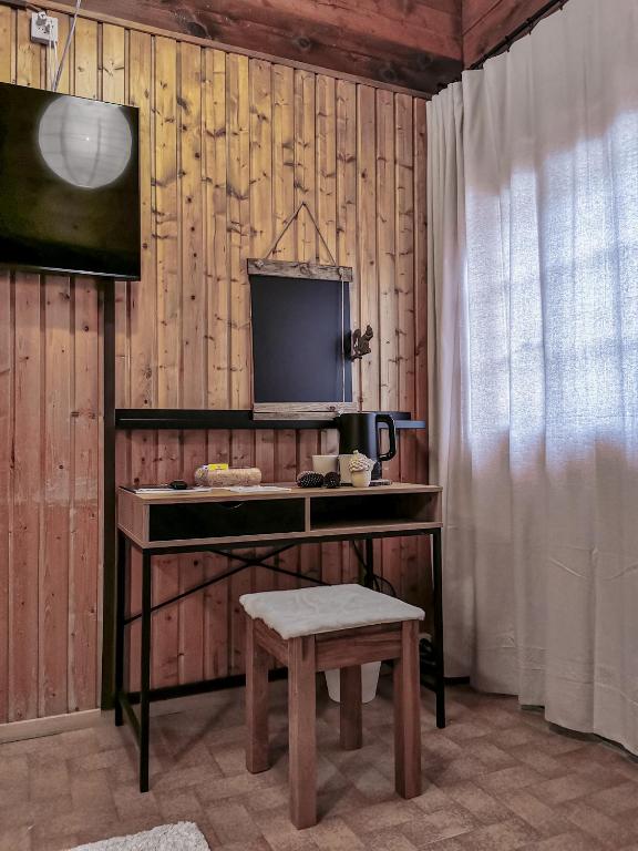 TV a/nebo společenská místnost v ubytování Relais des Mélèzes