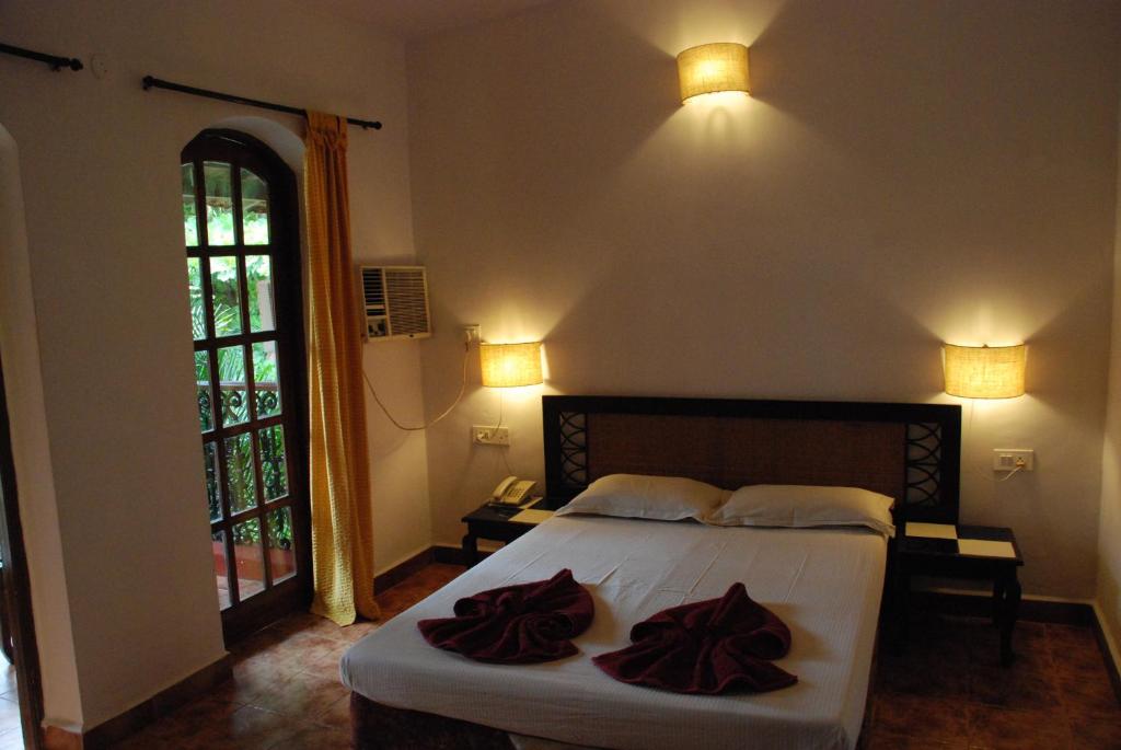 Postel nebo postele na pokoji v ubytování Sea Breeze Beach Resort Candolim, Goa