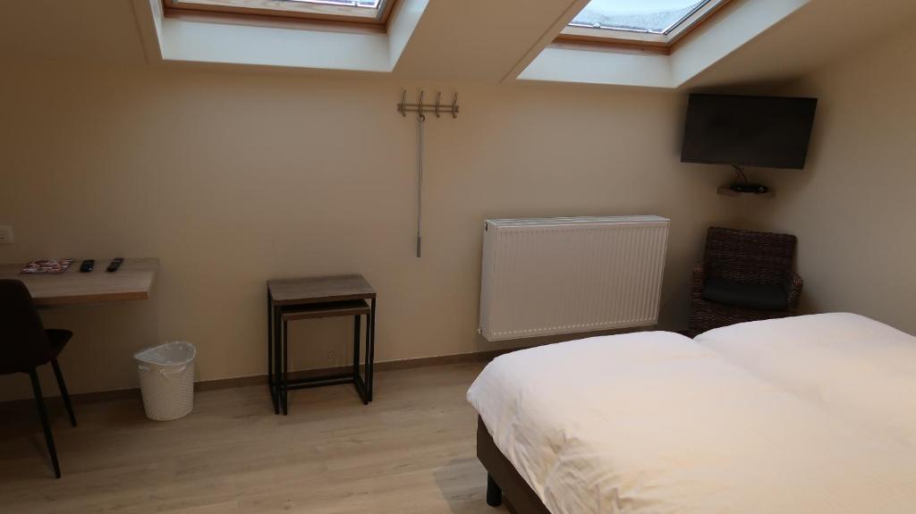 Postel nebo postele na pokoji v ubytování B&B La Vie En Roses